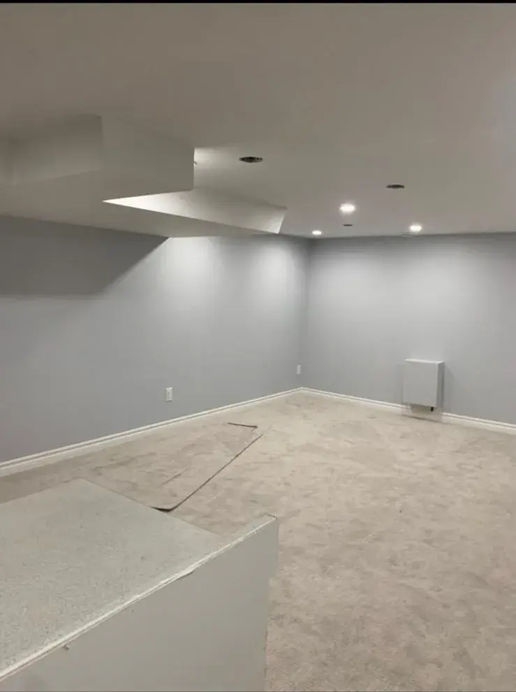 New carpet installed in a finished basement room