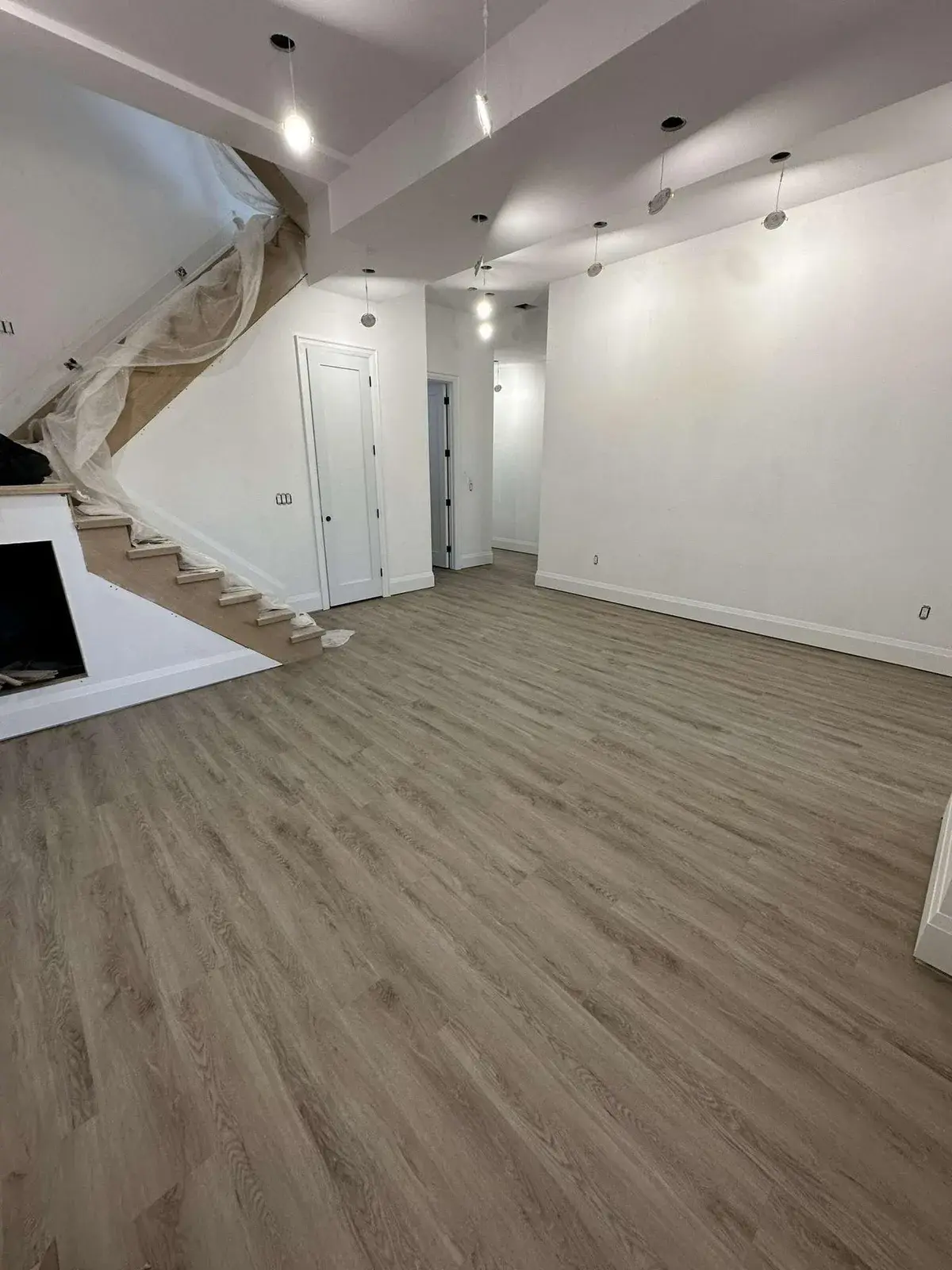Finished basement with new vinyl plank flooring