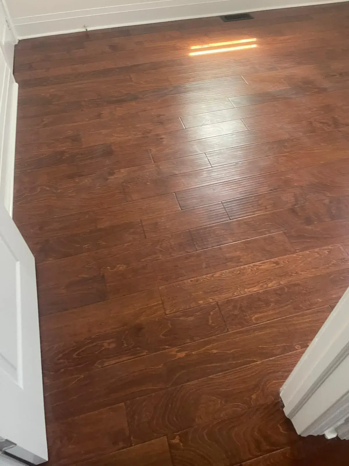 Medium-brown hardwood floor in a finished room
