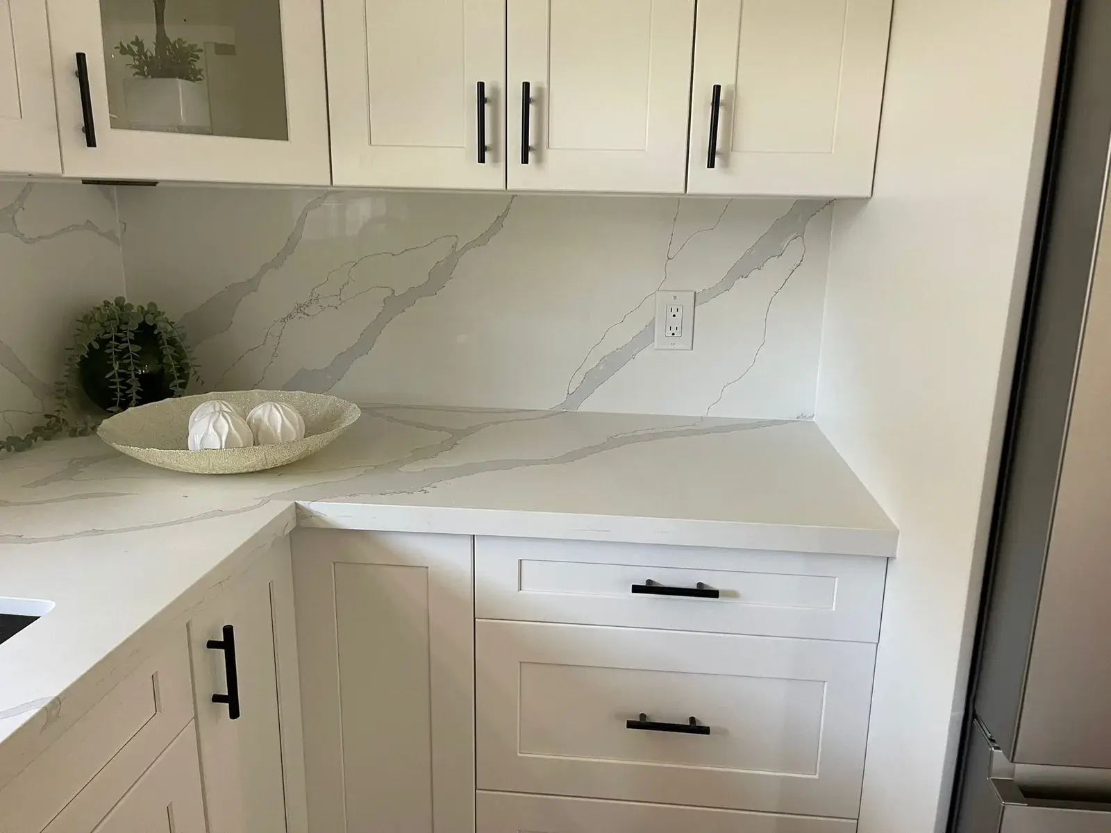 Quartz countertop with a matching full-height backsplash